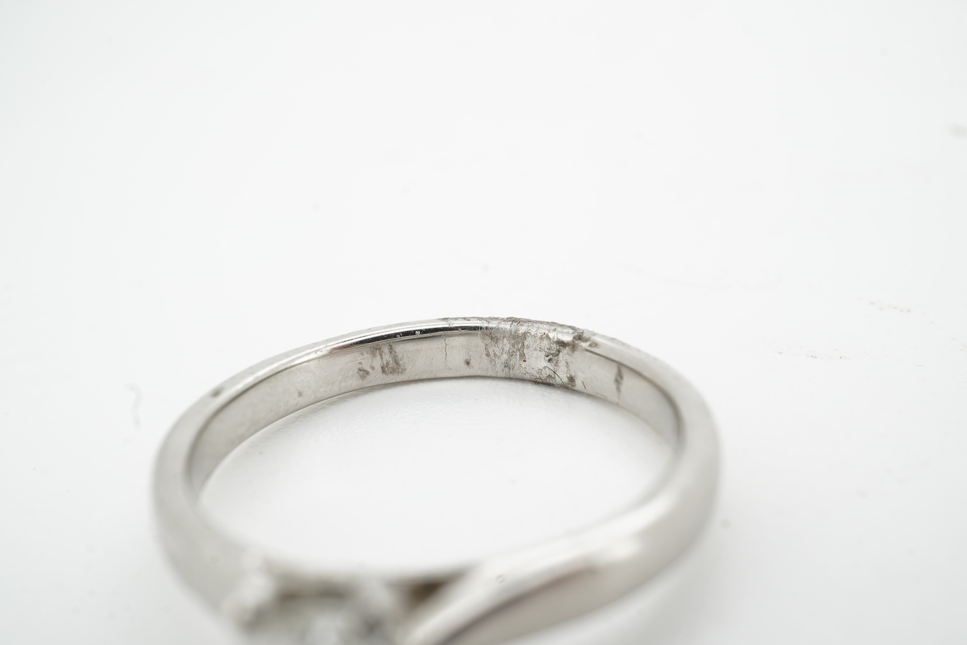 A diamond ring, claw-set with a pear-shaped diamond weighing approximately 0.45 carats, mounted in platinum, size L1/2, British hallmarks, gross weight approximately 4 grams